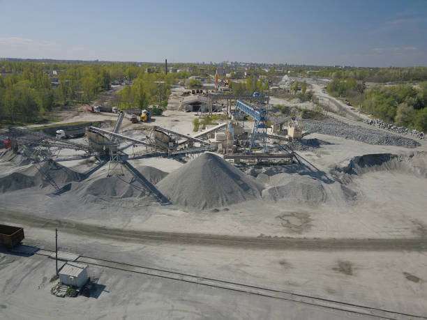 istock Extraction, washing, sorting and distraction of river gravel. Mining industry. Technology of obtaining a stone. A bird's eye view. Shooting with a quadrocopter. Metal construction of sorting of rubble 1224803703
