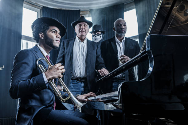 istock Black Piano Playing Man and a trumpet player 1224803938