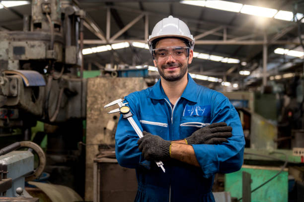 istock Engineers and skilled technicians are maintaining machinery. Engineers are working and repairing machines in industrial. Technician holding Measuring pliers. Scale Metal Vernier caliper measuring. 1224803975
