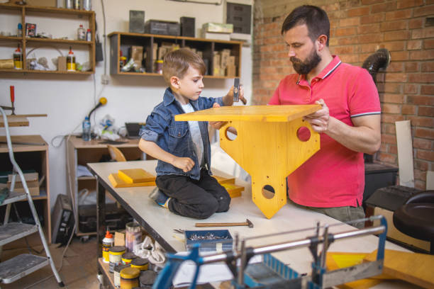 istock Father and Son Making a Birdhouse 1224804643
