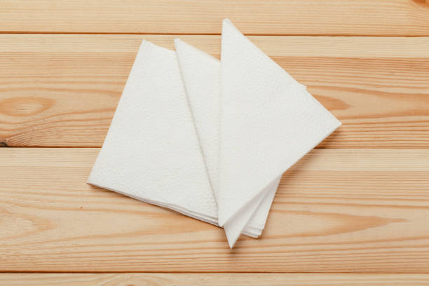 istock white paper napkin or tissue on the wooden table background. 1224804722