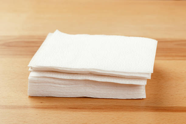 istock white paper napkin or tissue on the wooden table background. 1224804862