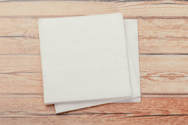istock white paper napkin or tissue on the wooden table background. 1224804890