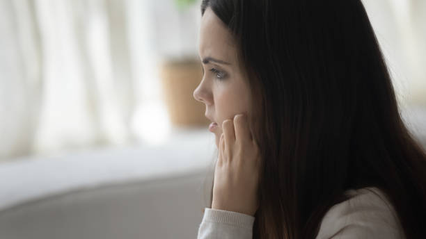 istock Millennial girl look in distance thinking or mourning 1224807902