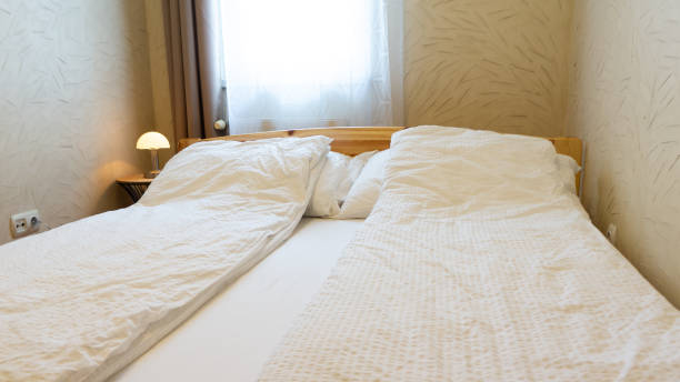 istock room with bed and small lamp 1224810275