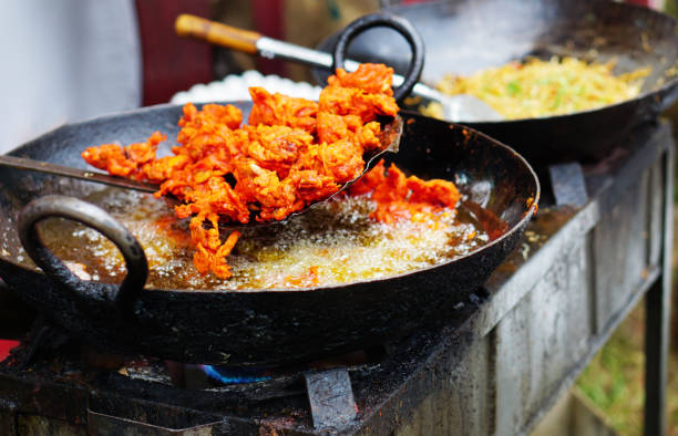 close -up of indian street vendor deep frying mutton in pan - non veg imagens e fotografias de stock