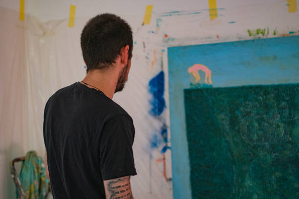 istock An artist looking at the painting 1224810521