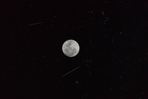 istock The two shooting stars with full moon in the night 1224811250