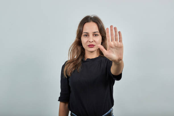istock Dissenting Girl Against, Shows Protest, Opposition, Gesturing With Her Hand 1224812357