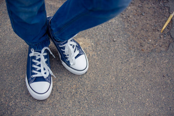 istock Childs feet in nice new blue sneakers 1224813971