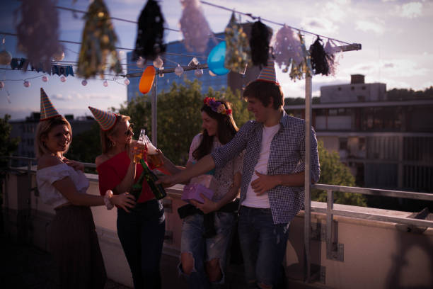 istock Four young people partying on the rooftop 1224814213