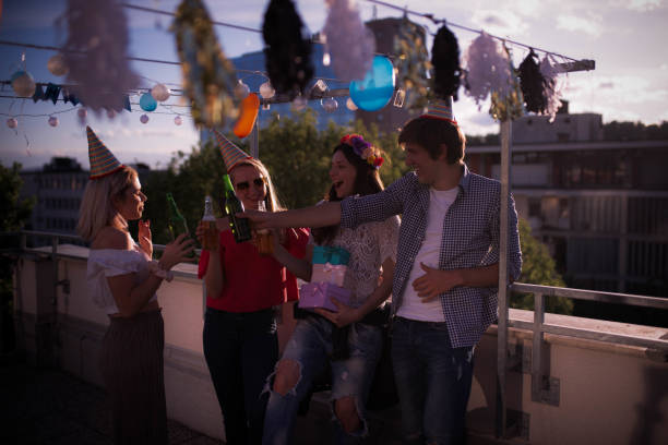 istock Four young people partying on the rooftop 1224814223