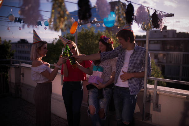 istock Four young people partying on the rooftop 1224814228