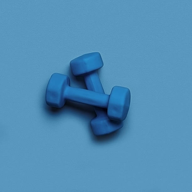 istock two blue dumbbells on a blue monochrome background 1224815491