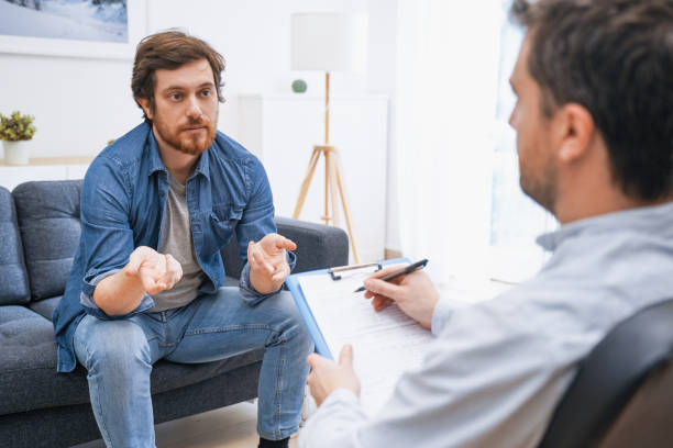 istock Psychologist doctor taking notes during psychotherapy session 1224818048