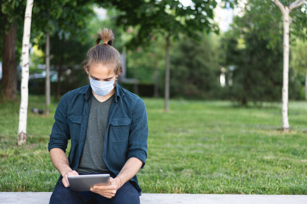 istock Young man wearing protective face mask during Covid-19 quarantine 1224818216