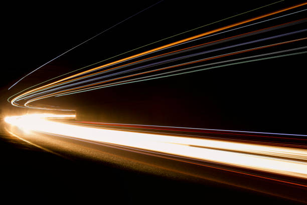 istock Lights. Car headlights. Car light trails on the road 1224819841