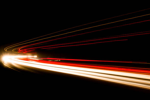 istock Lights. Car headlights. Car light trails on the road 1224819860
