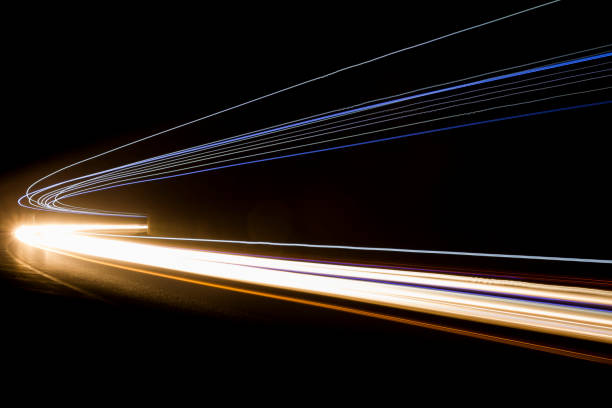 istock Lights. Car headlights. Car light trails on the road 1224819861