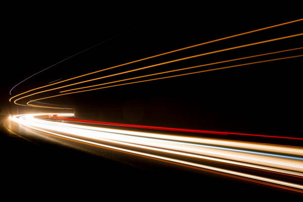 istock Lights. Car headlights. Car light trails on the road 1224819865