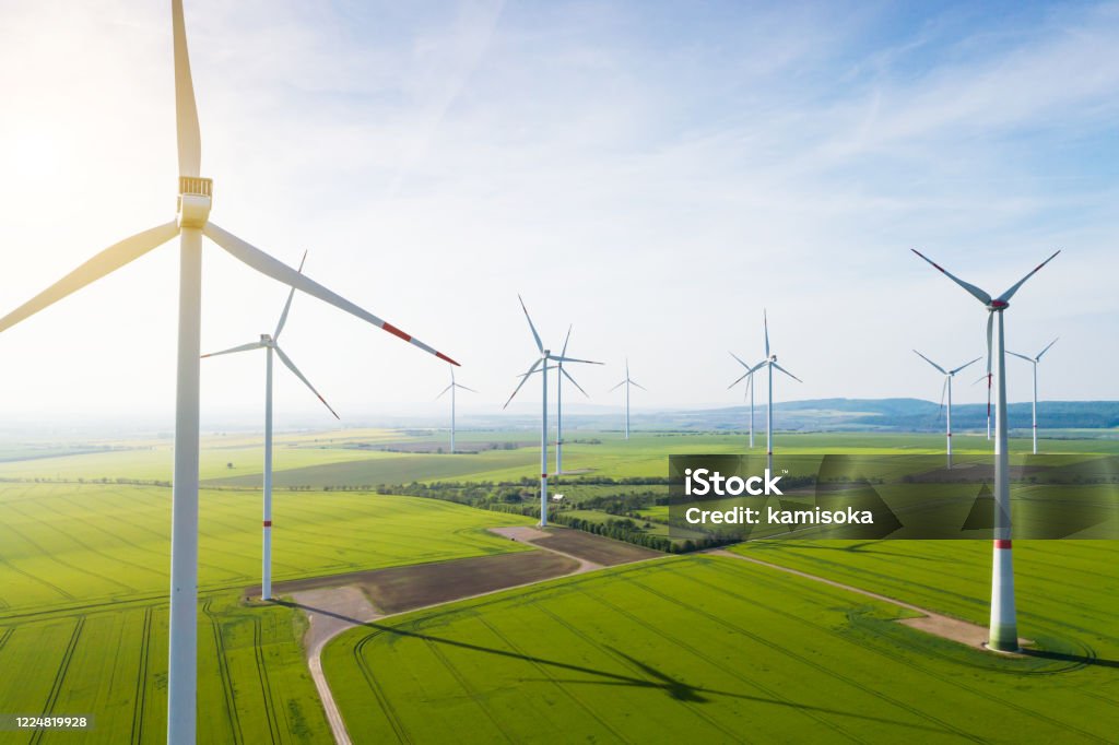Aerial view of wind turbines and agriculture field Wind Turbine Stock Photo