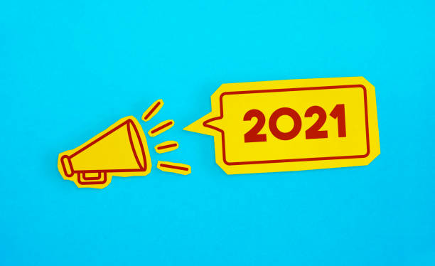 Megaphone drawing on the cut yellow paper makes 2021 announcement.