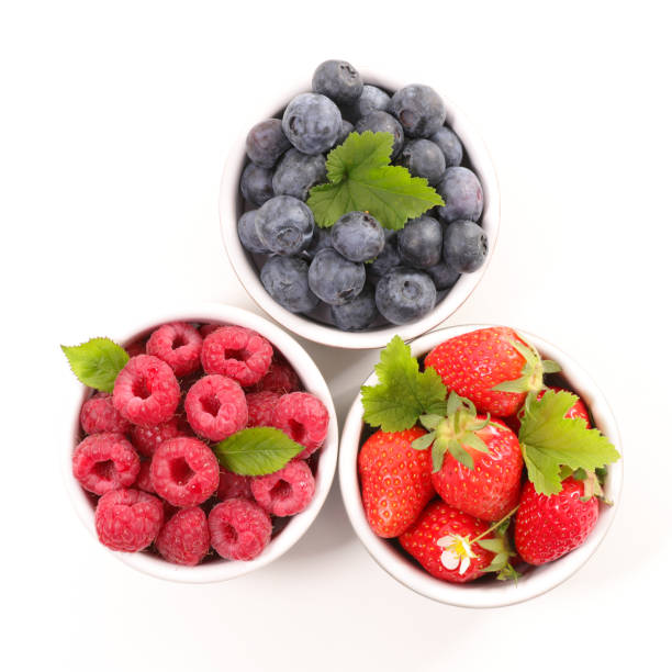 istock assorted of berry fruit- blueberry, strawberry and raspberry isolated on white background 1224820808