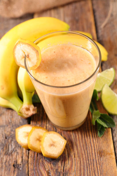 istock smoothie with banana on wood background 1224820834