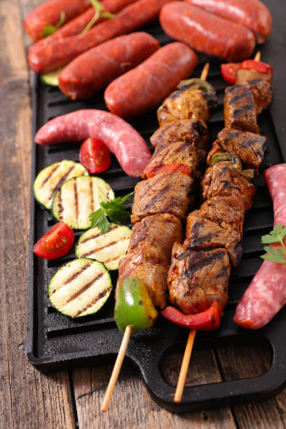 istock pork meat and sausage on grill 1224820902