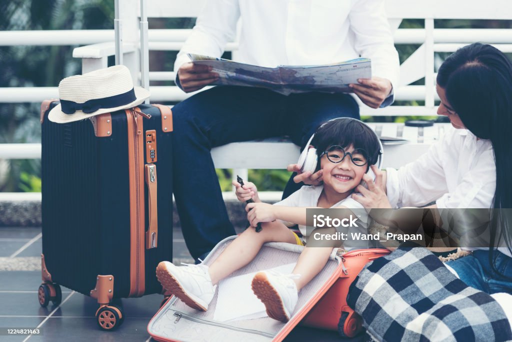 Happy family planning travel in summer vacation. Asia young people lifestyle packing bag luggage and enjoy fun and relax leisure destination in holiday. Travel and Family Concept Asia Stock Photo