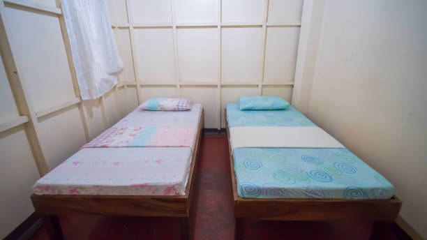 istock Budget Triple Hostel Room. Two beds. Asian country 1224822562