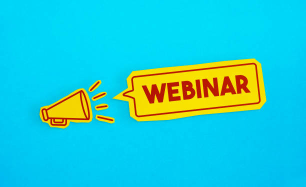 Megaphone drawing on the cut yellow paper makes Webinar announcement.