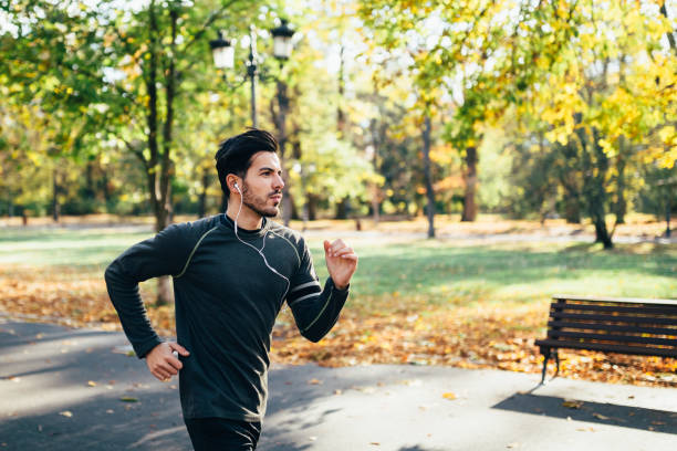 istock Young man jogging in the city park 1224822792