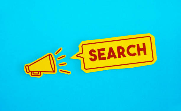 istock Megaphone drawing on the cut yellow paper makes Search announcement. 1224822833