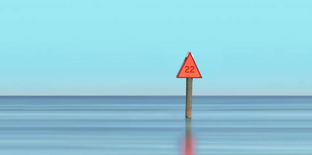 Channel Marker with Negative Space Channel Marker in blurred water with negative space channel marker stock pictures, royalty-free photos & images