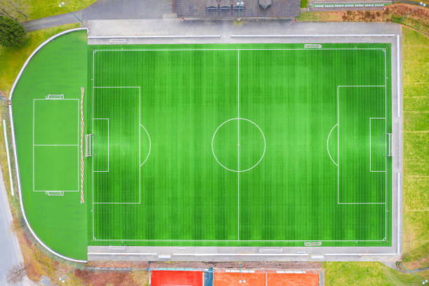 istock a green empty soccer field from above 1224825519
