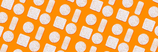 istock Pattern made of rice crackers or rice cakes on orange color background. 1224826739