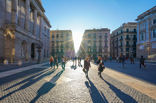 Barcelona Spain - Jan 12 2020: People walking on famous Plaza de Sant Jaume near historical Gothic Quarter in Barcelona Spain under sunlight in sunny day