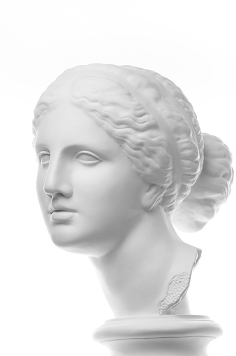 White gypsum copy of ancient statue of Venus de Milo head for artists isolated on a white background. Plaster sculpture of woman face.