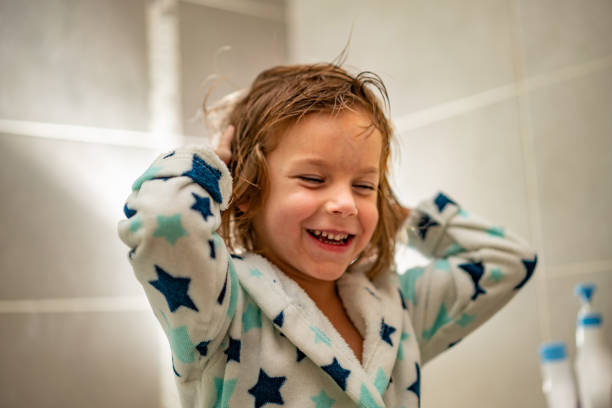 istock Little boy drying his hair in bathroom 1224830188