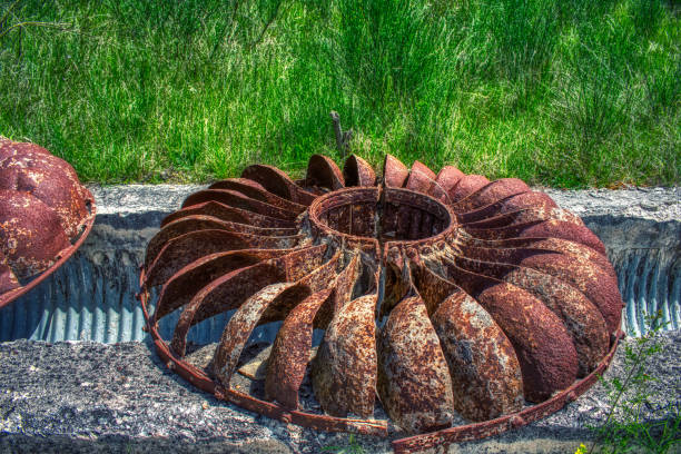 istock ancient rusty hydroelectric turbines with green backgrounds 1224831681