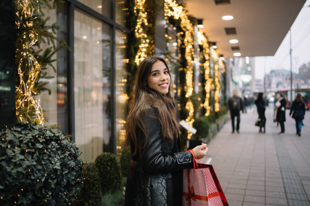 istock Pretty girl looking at camera while walking on street 1224831765