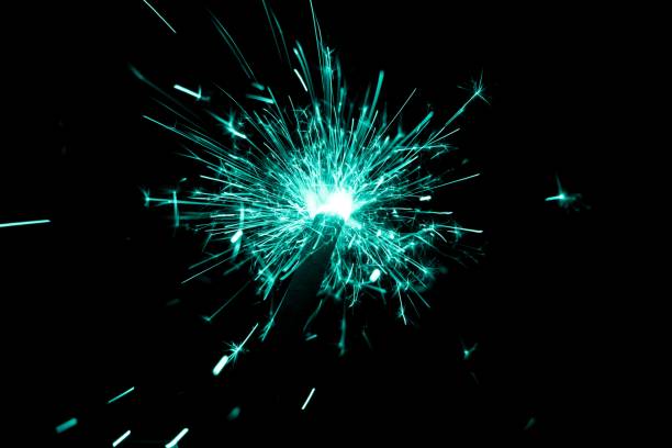 istock Turquoise sparkler countdown on fire with spread glitter sparks 1224834159