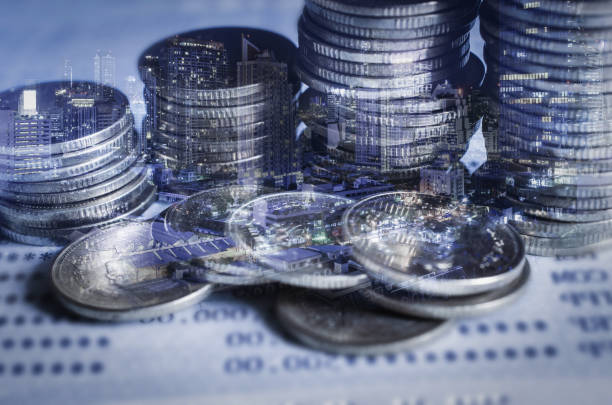 istock double exposure of city with row of coin stack with growth chart and graph progress report for business investment finance banking and money saving concept. 1224836324