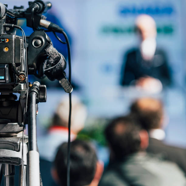 istock Media Event. Camera Recording Male Speaker On Stage 1224836545