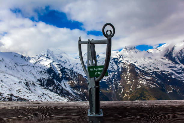 Pointer to the highest peak of the Alps - Grossglockner - 3798 meters. Austria. The first snow fell on Grossglockner Alpine Road. Ecological, active and photo tourism concept