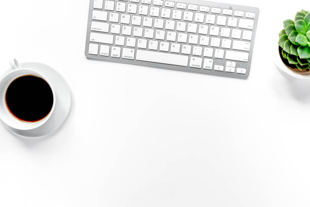 istock office desk with keyboard and coffee white background top view space for text 1224841694