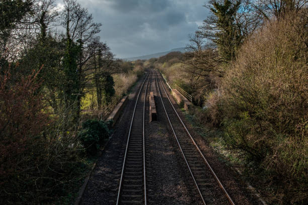 istock An empty railway track in the UK, under a cloudy spring sky 1224844466