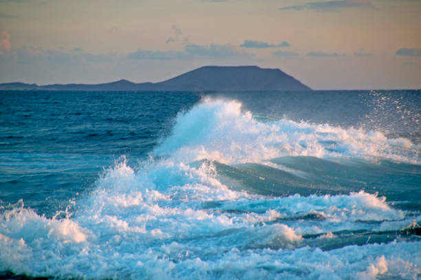 istock Lanzarote, surf in the evening light 1224845156