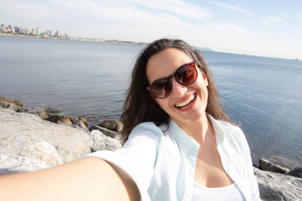 istock Smiling woman taking a selfie 1224848866